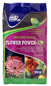 A bag of Pro Tek Organic Based Flower Power plant food with an image of a flower and vegetables on it.