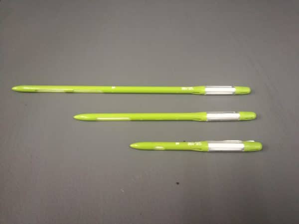 Three light green and white water markers positioned neatly in a line.