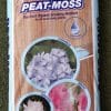 Bag of Pro-Tec peat moss, an acidic blend growing medium containing sphagnum peat moss, with images of three different flowers on it.