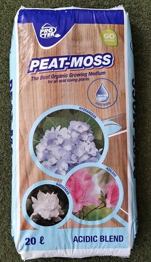 Bag of Pro-Tec peat moss, an acidic blend growing medium containing sphagnum peat moss, with images of three different flowers on it.