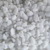 Densely packed white gravel or crushed stone.