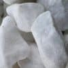 Large, irregularly shaped white rocks, possibly quartz or marble.