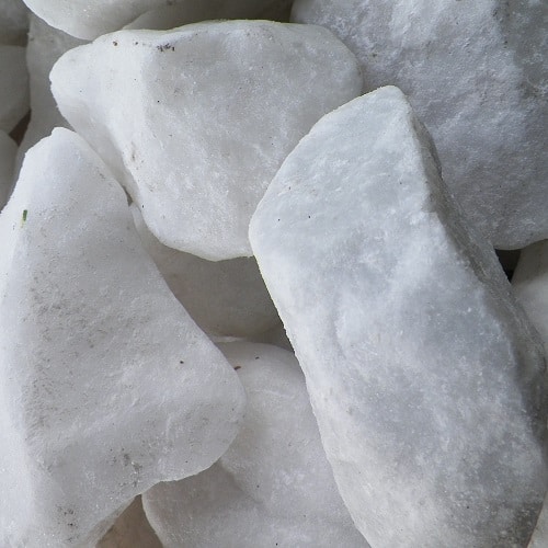 Large, irregularly shaped white rocks, possibly quartz or marble.