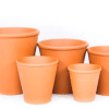 Multiple sizes of simple terracotta plant pots.