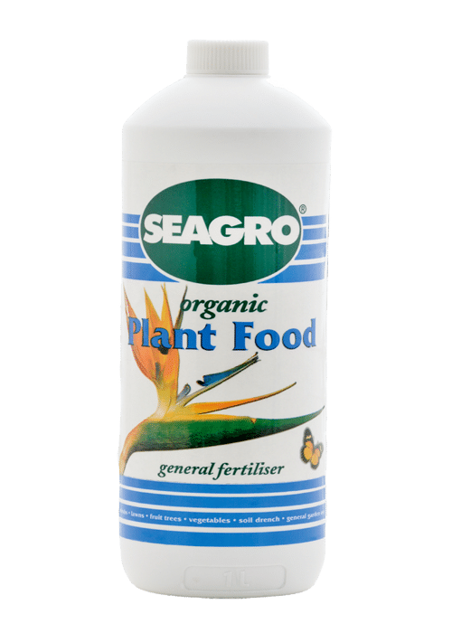 White bottle of Seagro organic plant food, with a birds of paradise illustration on the front.