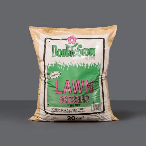 A bag of DoubleGrow Lawn Dressing set against a grey background.