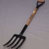 A forged pitchfork made of power-coated carbon steel for digging in the garden.