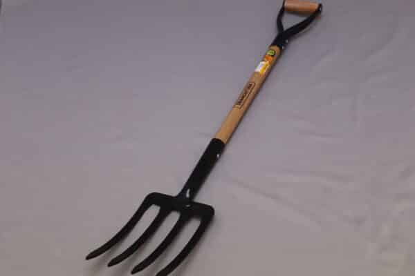 A forged pitchfork made of power-coated carbon steel for digging in the garden.