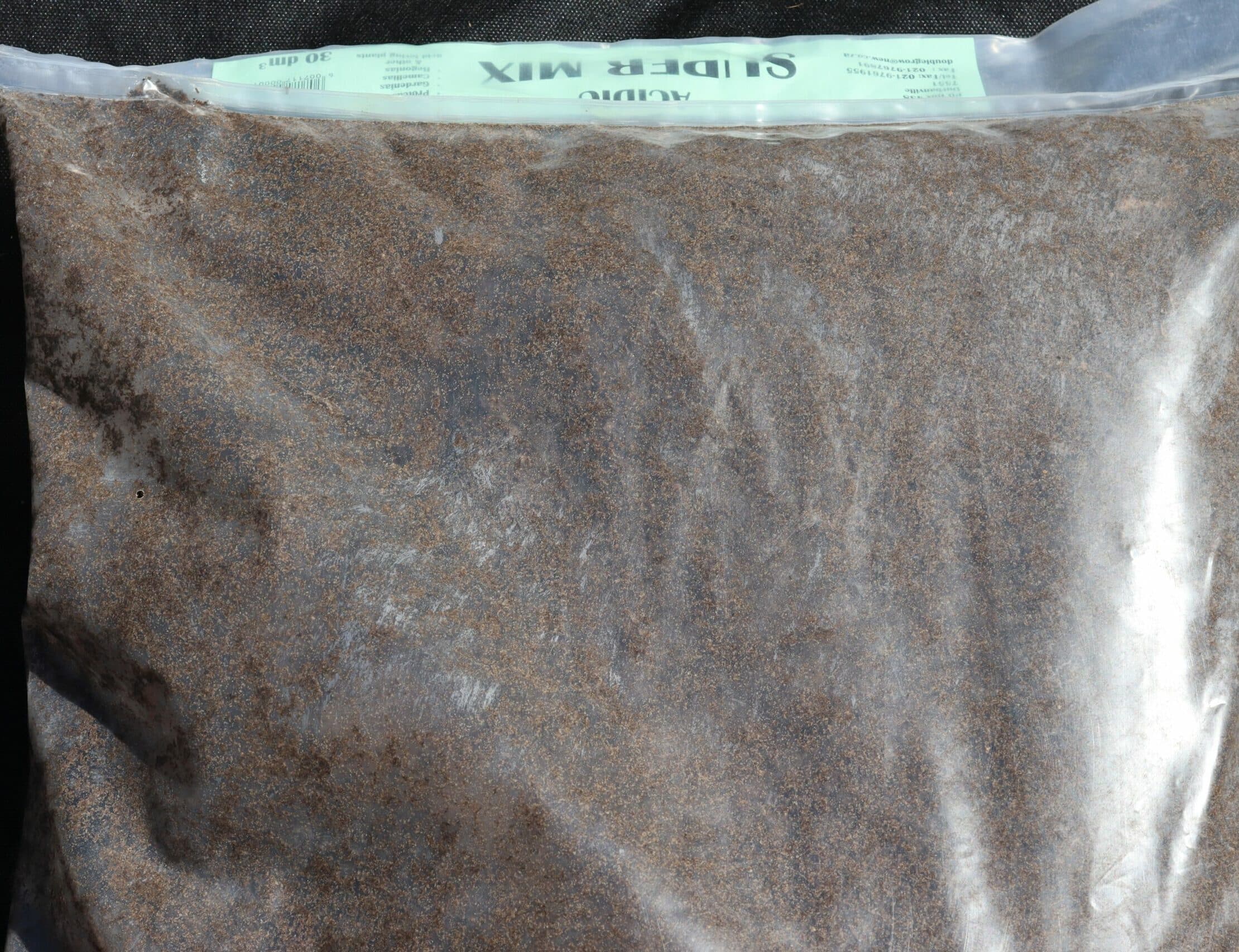 A plastic bag of Double Grow acidic super mix for acidic plants.
