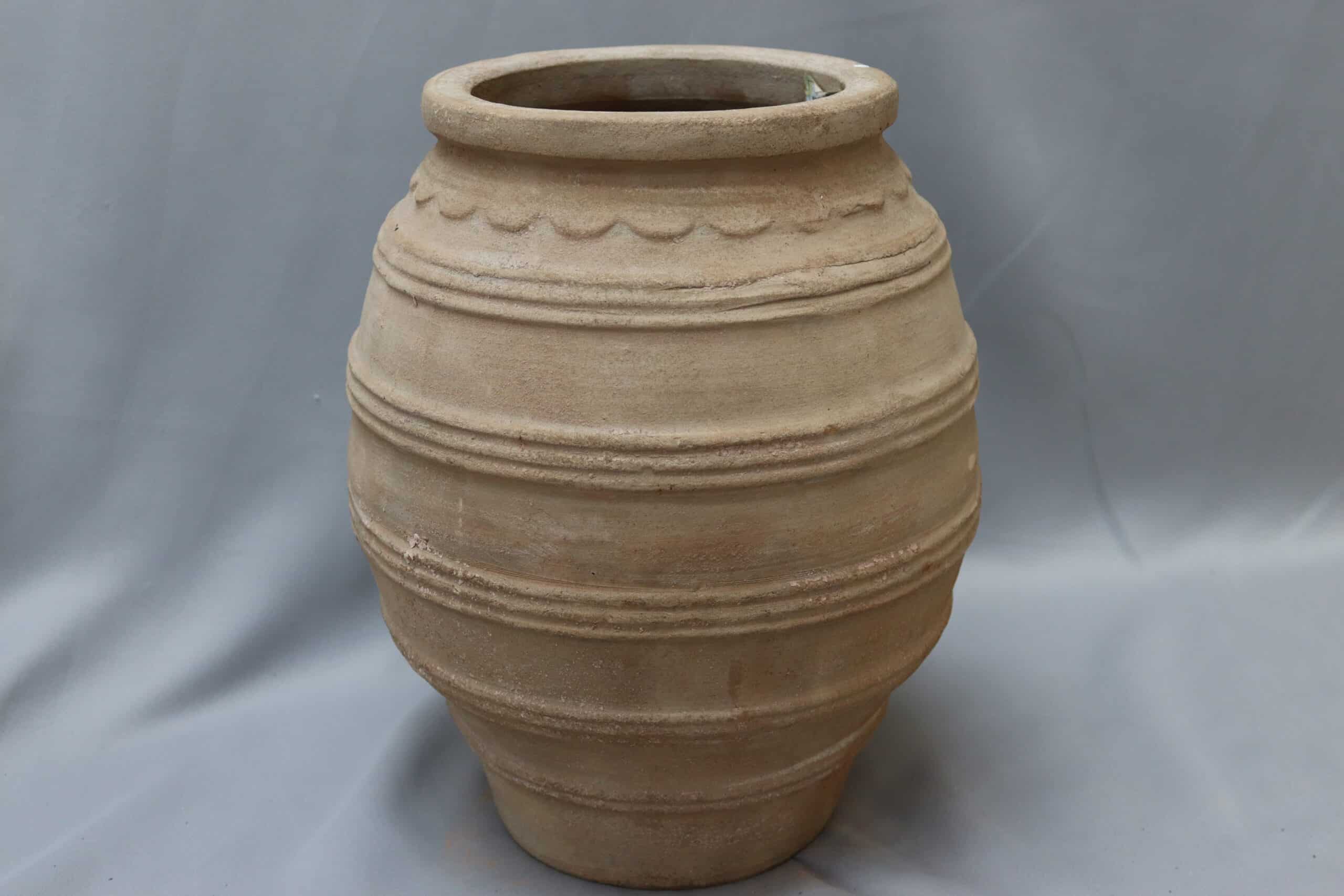 A small stone-coloured Palermo urn plant pot.