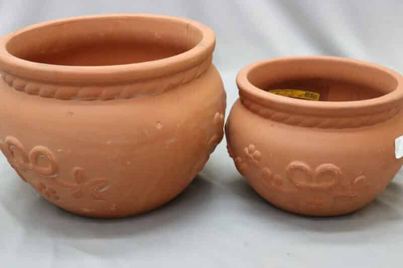 Small and medium-sized ceramic clay lily plant bowls.