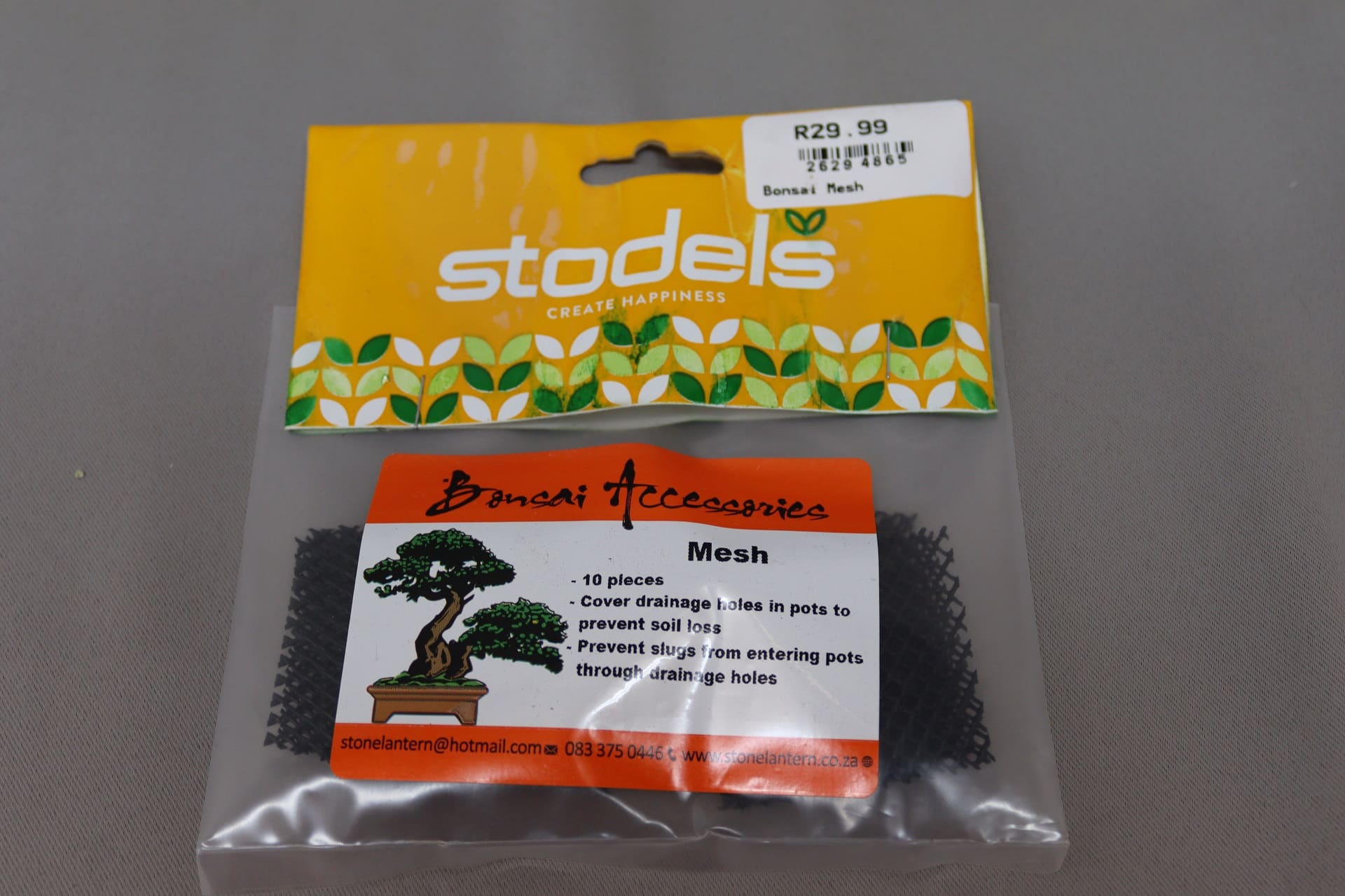 Small transparant plastic bag with yellow Stodels branding containing bonsai mesh.