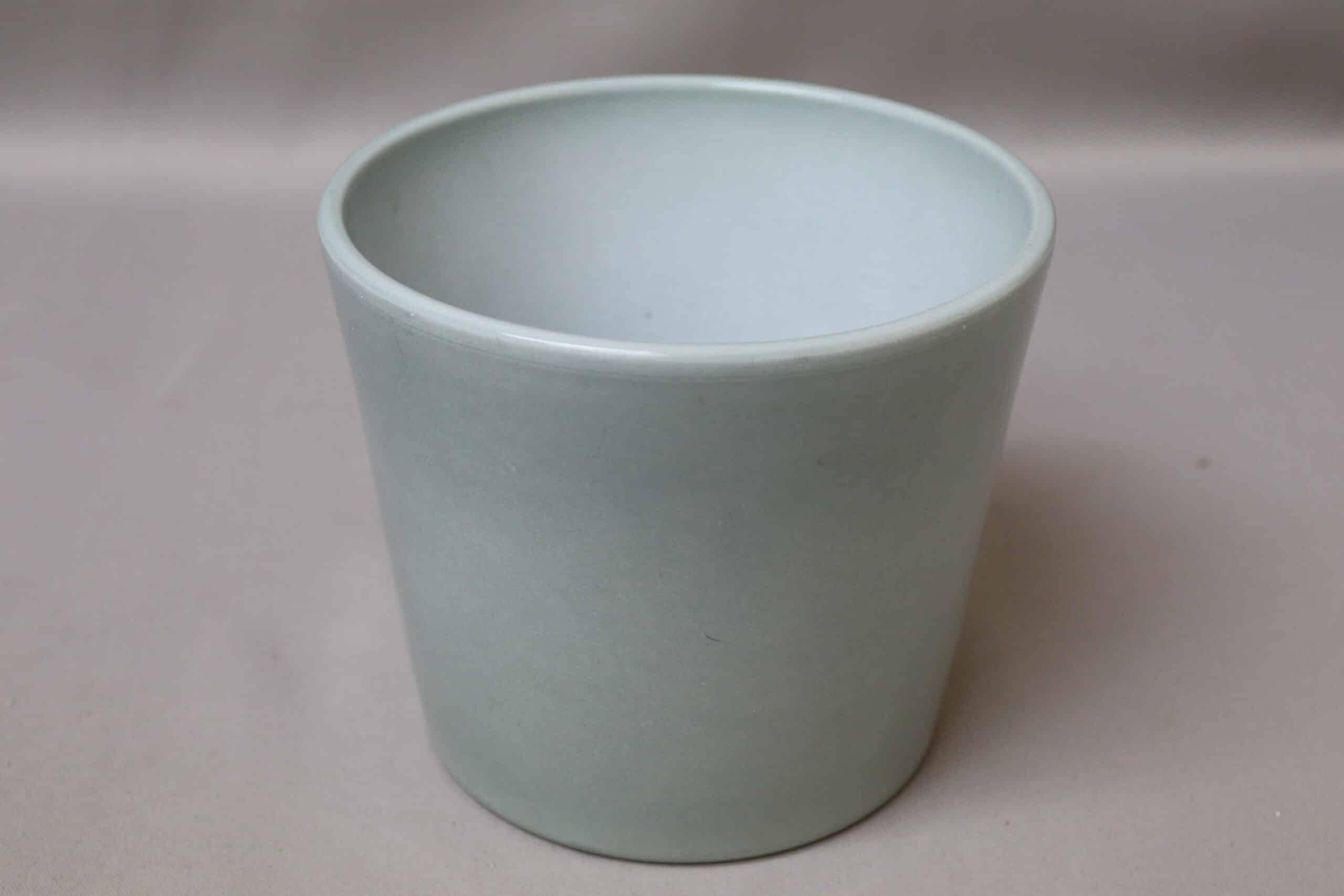 Smooth light jade green pot cover for potted plants.