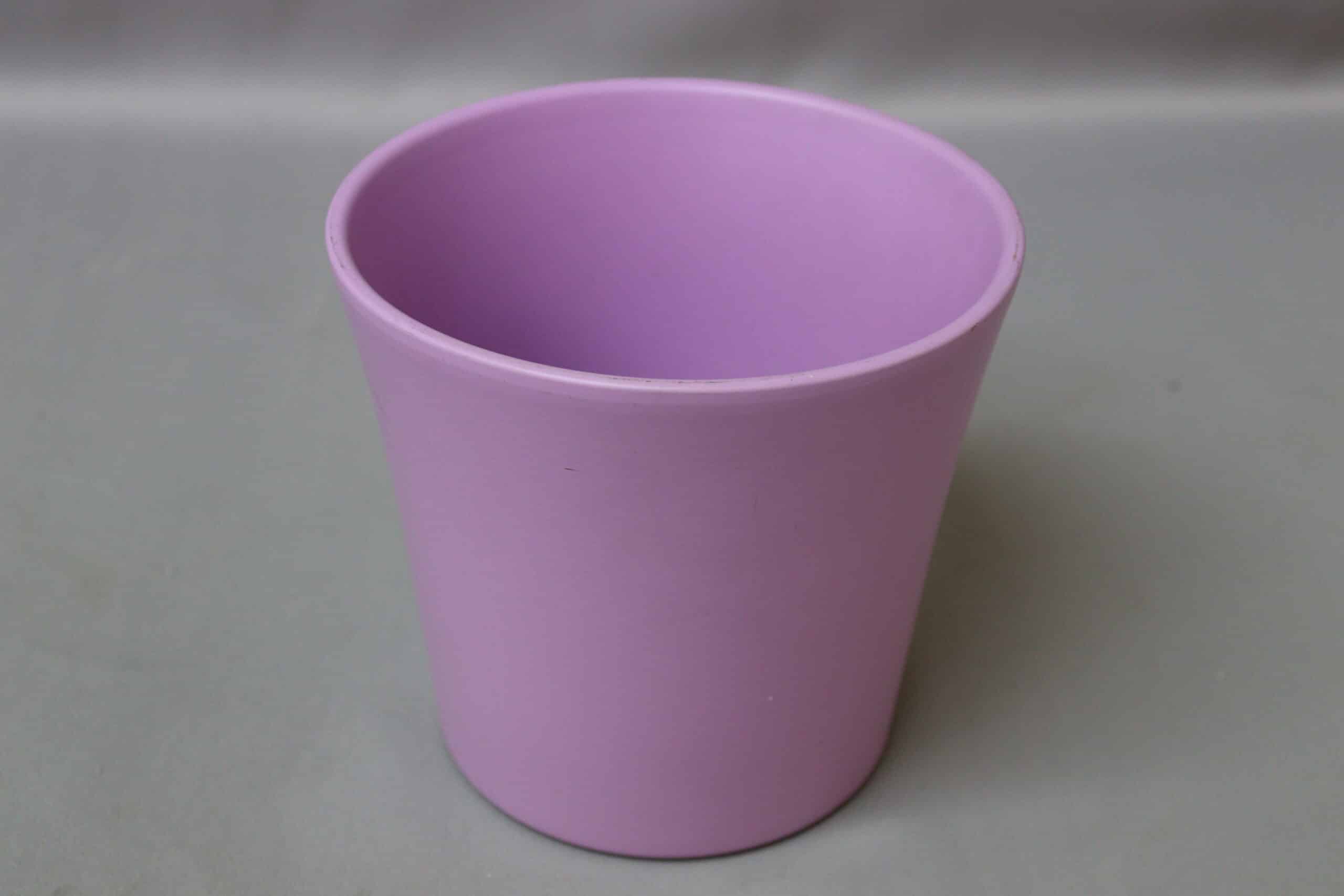 Smooth, matte, lavender-coloured pot cover for potted plants.