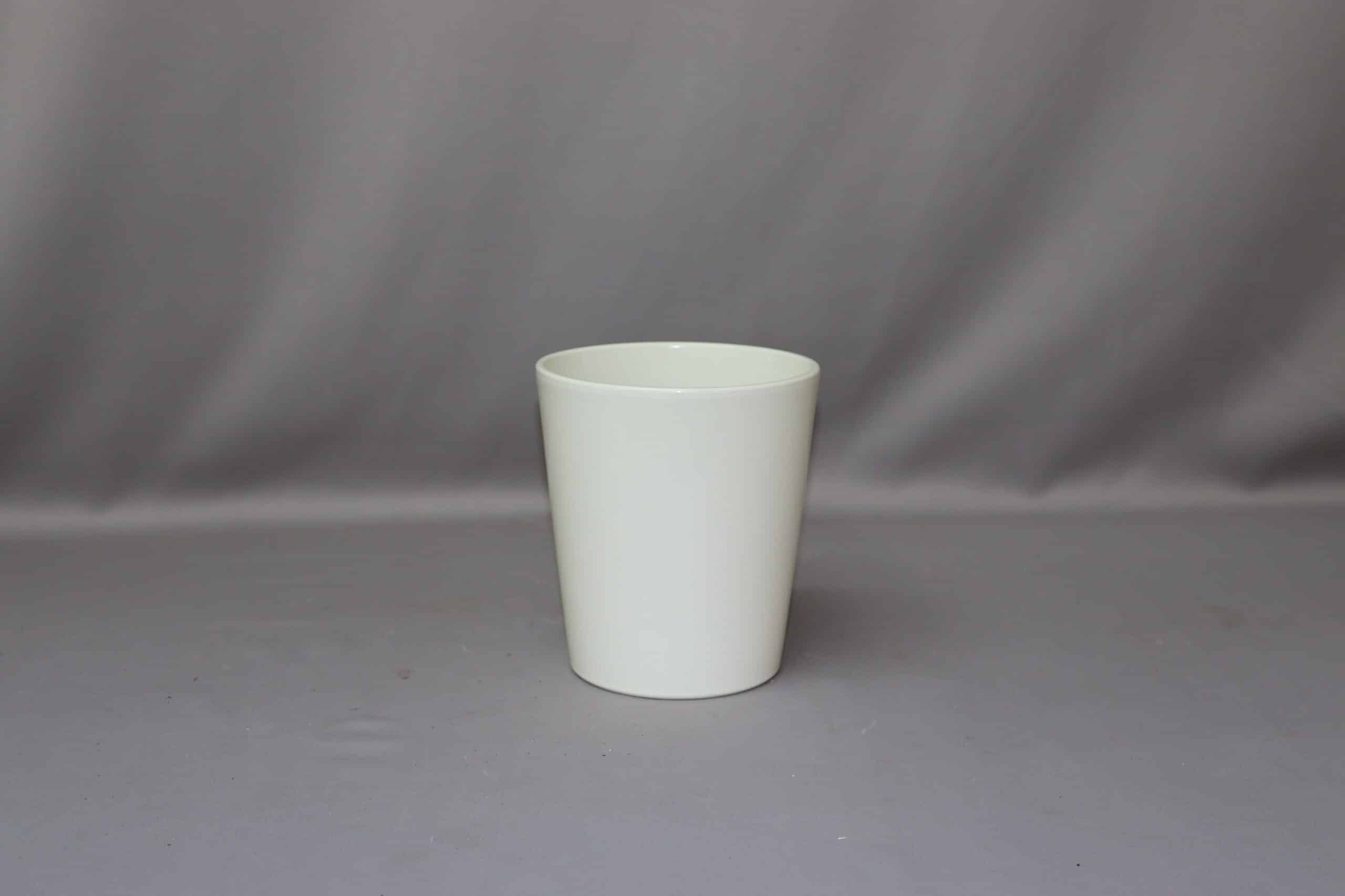 Smooth white pot cover for potted plants.