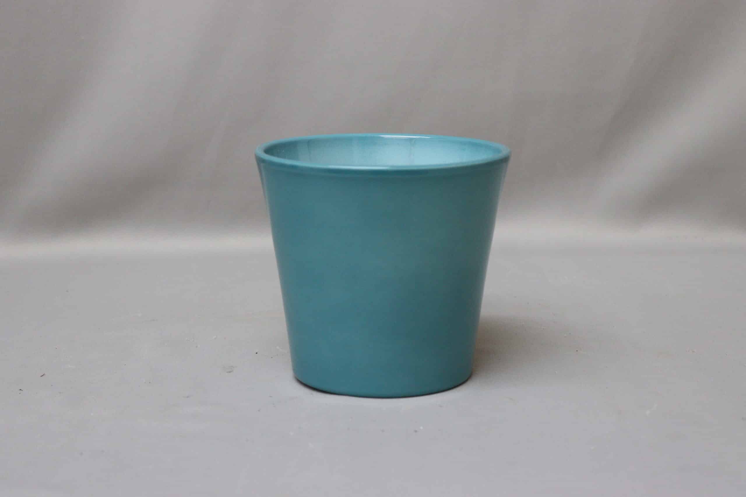 Medium-sized smooth turquoise blue pot cover for potted plants.