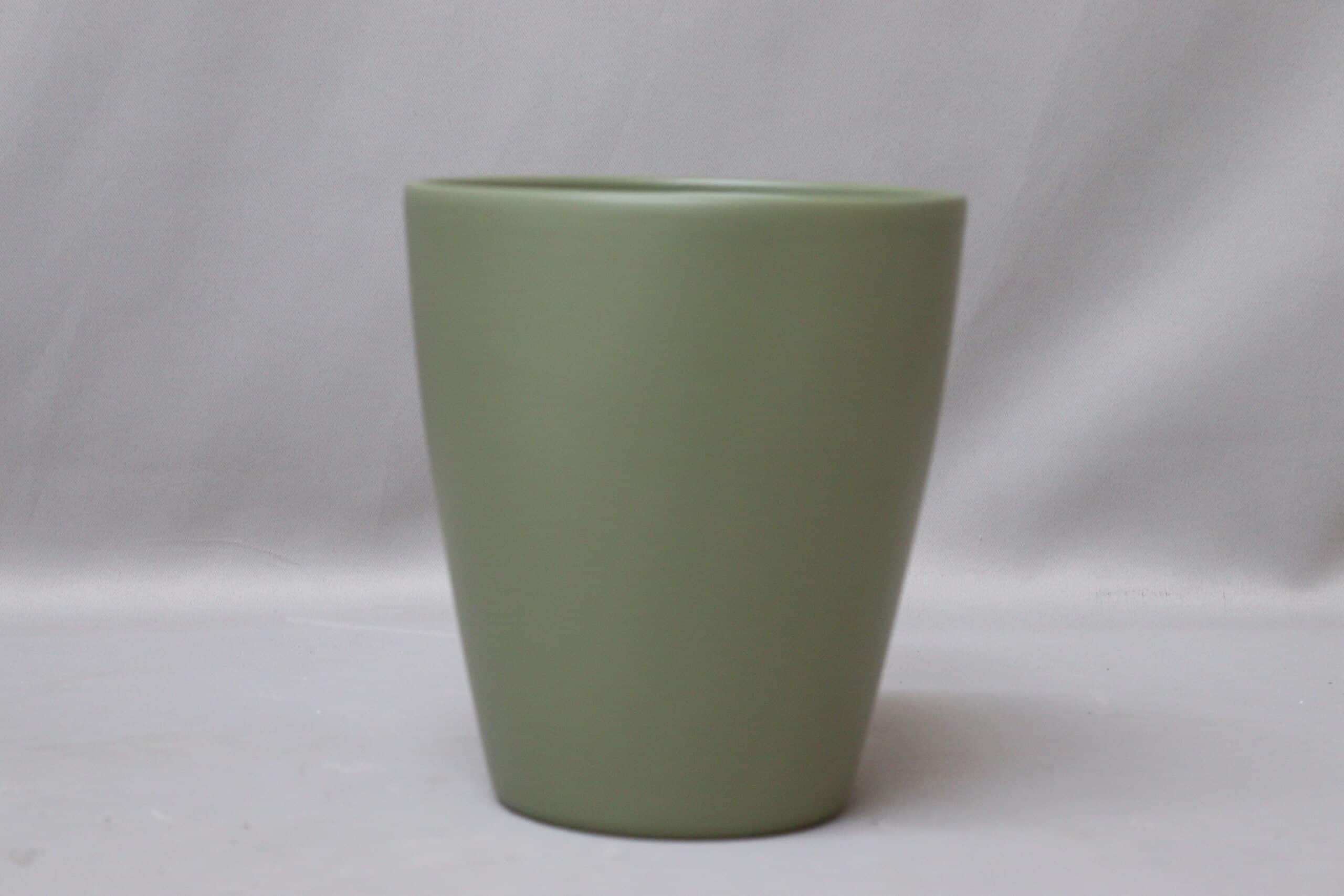 Smooth bottle green pot cover for potted plants.