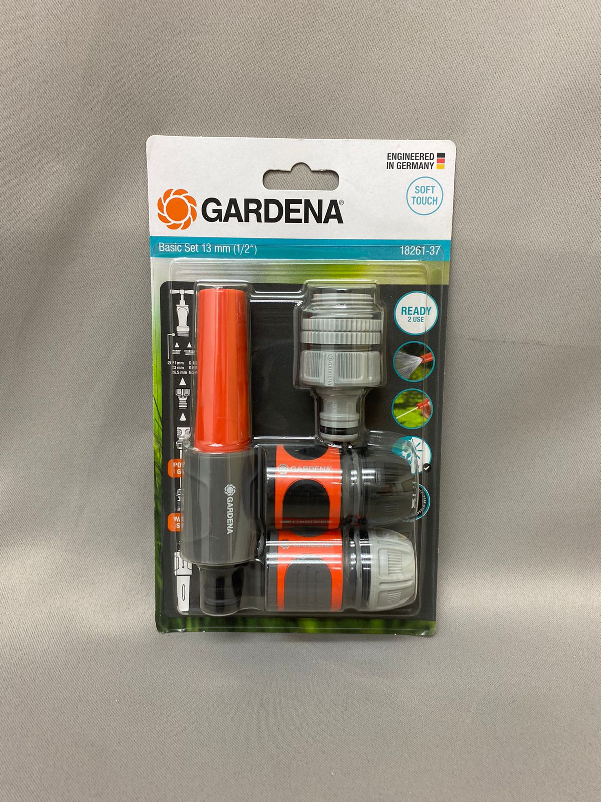A Gardena brand tap connector set in retail packaging against a plain background.